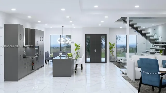 a kitchen with a refrigerator and a view of living room