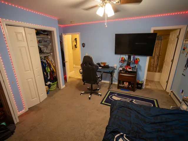 a room with furniture and a flat screen tv