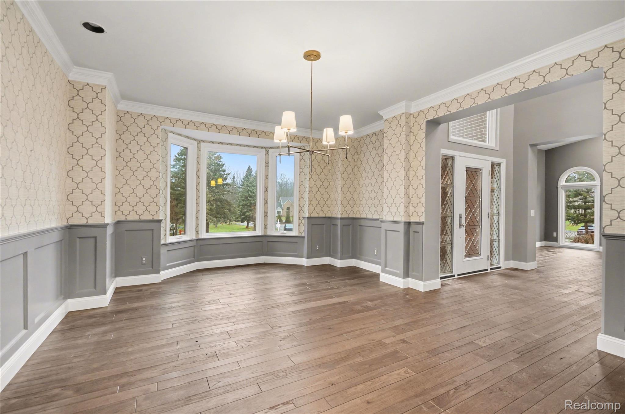 4179 St Andrews Street Howell, MI 48843 - Photo 21 of 75 Dining room features large bay window, wood floors, and wainscoting.