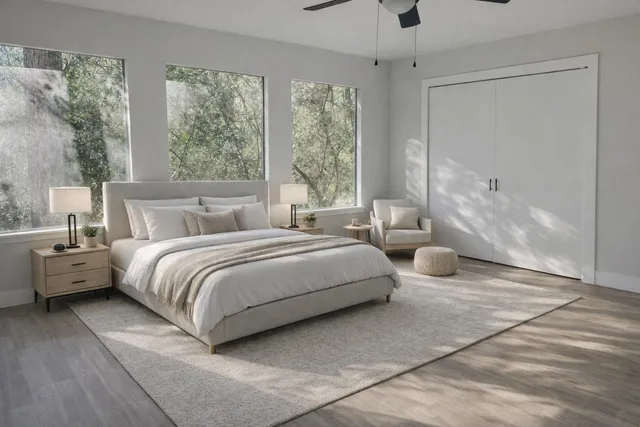 a spacious bedroom with a bed and window