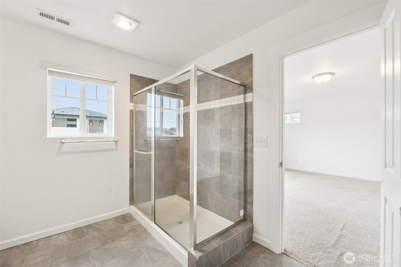 5310 52nd Street West University Place, WA 98467 - Photo 14 of 33 a bathroom with a glass shower door