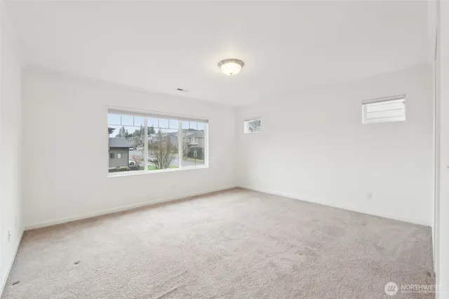 an empty room with large window