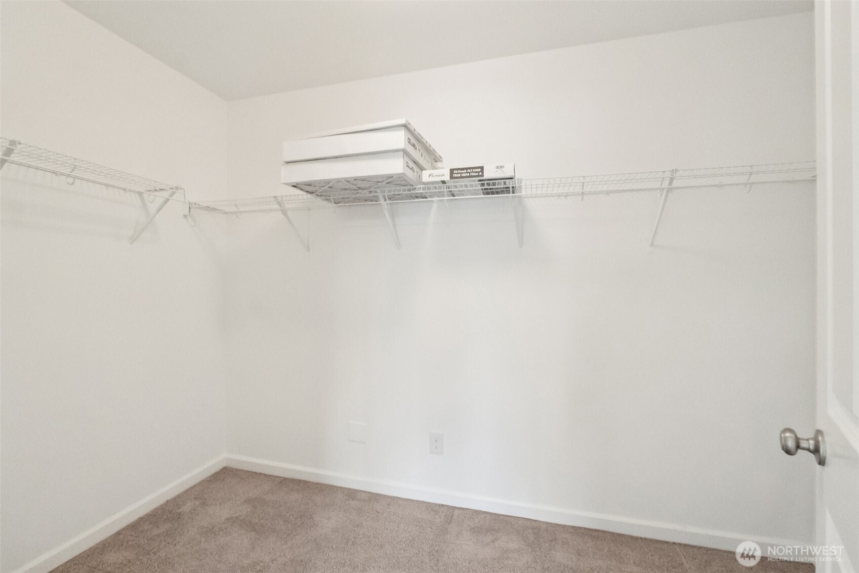 5310 52nd Street West University Place, WA 98467 - Photo 18 of 33 a picture of a room with racks on the wall