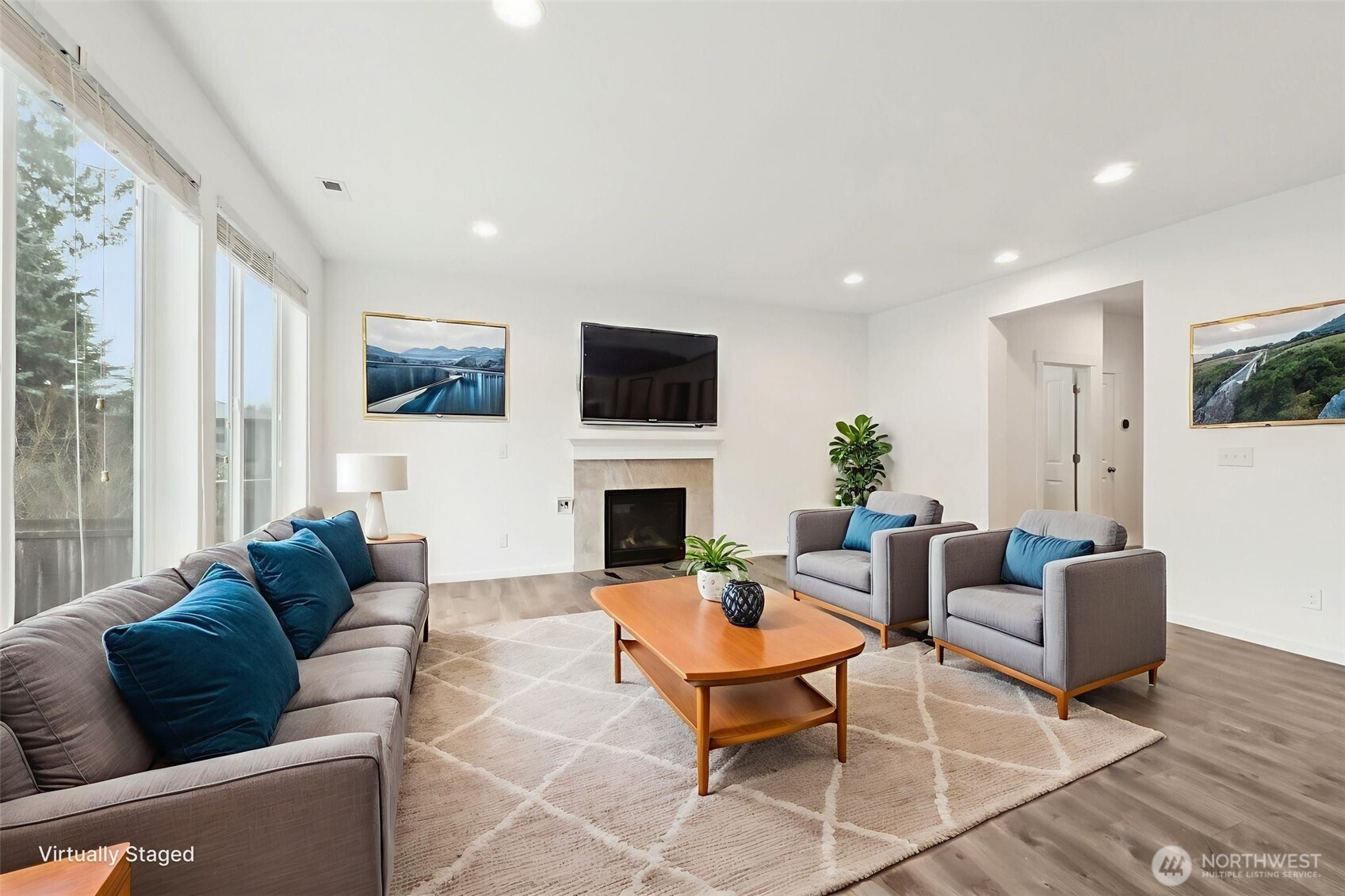5310 52nd Street West University Place, WA 98467 - Photo 5 of 33 a living room with furniture a fireplace and a flat screen tv