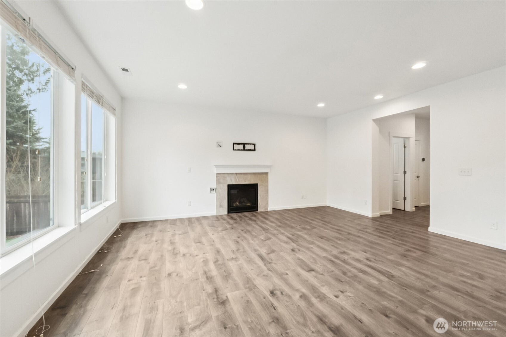 5310 52nd Street West University Place, WA 98467 - Photo 6 of 33 a view of empty room with wooden floor and fireplace