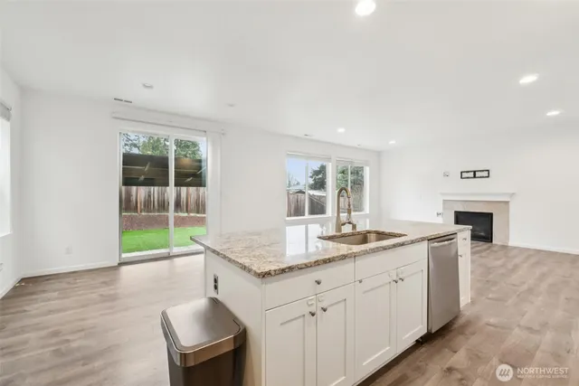 a kitchen with sink and window