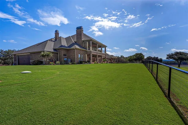 a view of a house with a big yard