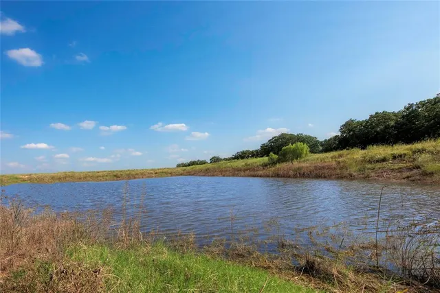 a view of lake with sunset