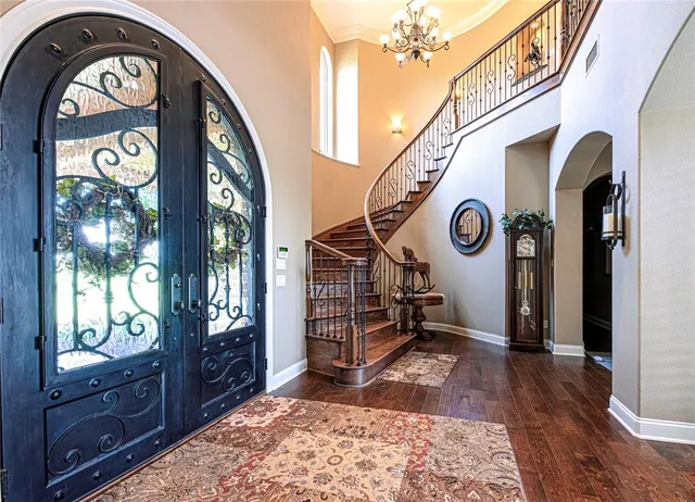 a view of an entryway with wooden floor