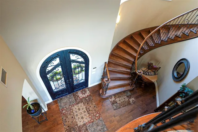 a view of an entryway with wooden floor