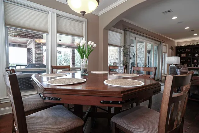 a view of a dining room with furniture and window