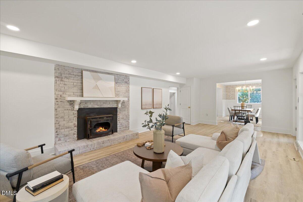1615 Carbonton Road Sanford, NC 27330 - Photo 22 of 49 a living room with furniture and a fireplace