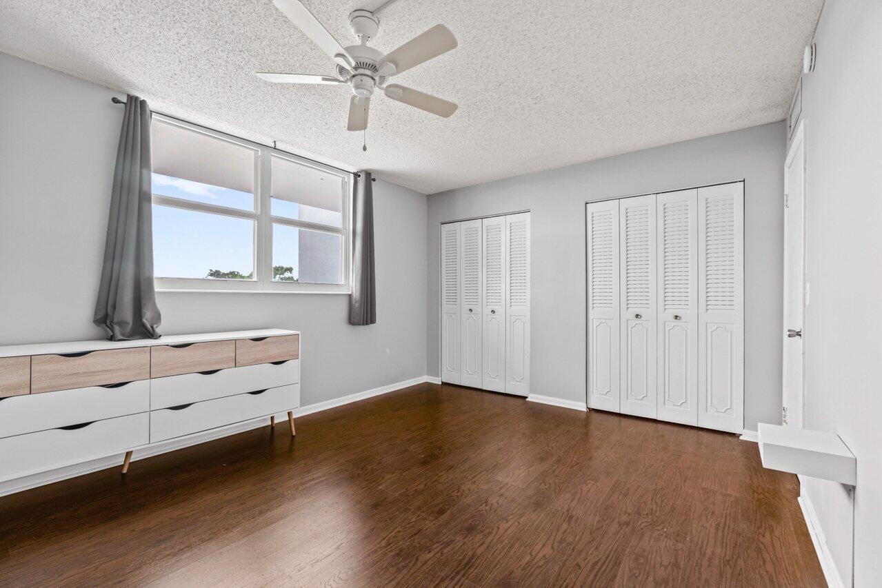 5700 Northwest 2nd Avenue, Unit 401 Boca Raton, FL 33487 - Photo 12 of 30 wooden floor in an empty room