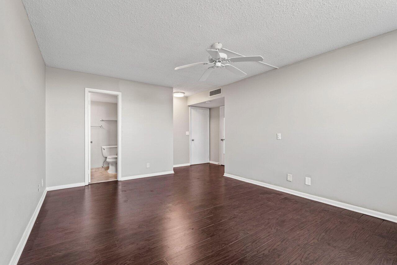 5700 Northwest 2nd Avenue, Unit 401 Boca Raton, FL 33487 - Photo 14 of 30 a view of an empty room with wooden floor