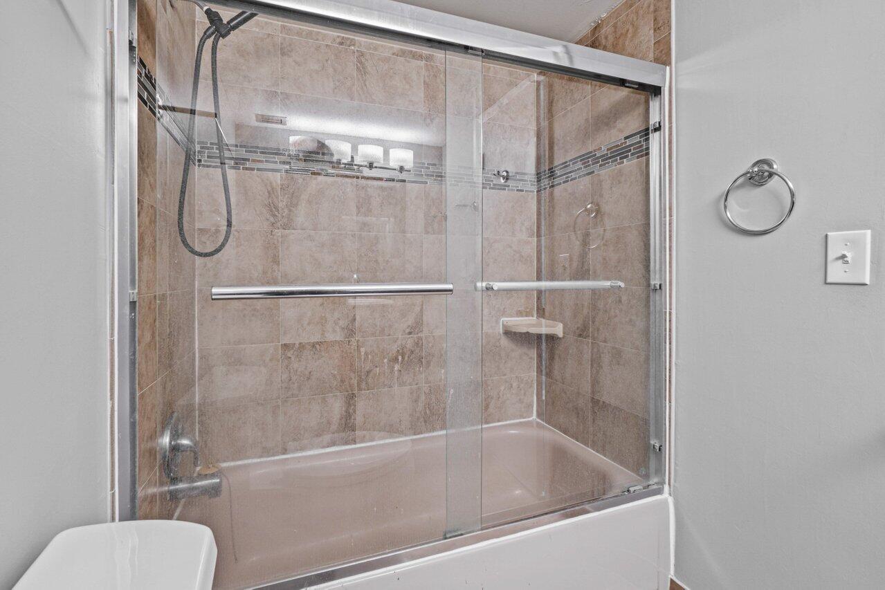 5700 Northwest 2nd Avenue, Unit 401 Boca Raton, FL 33487 - Photo 16 of 30 a bathroom with a tub and a shower