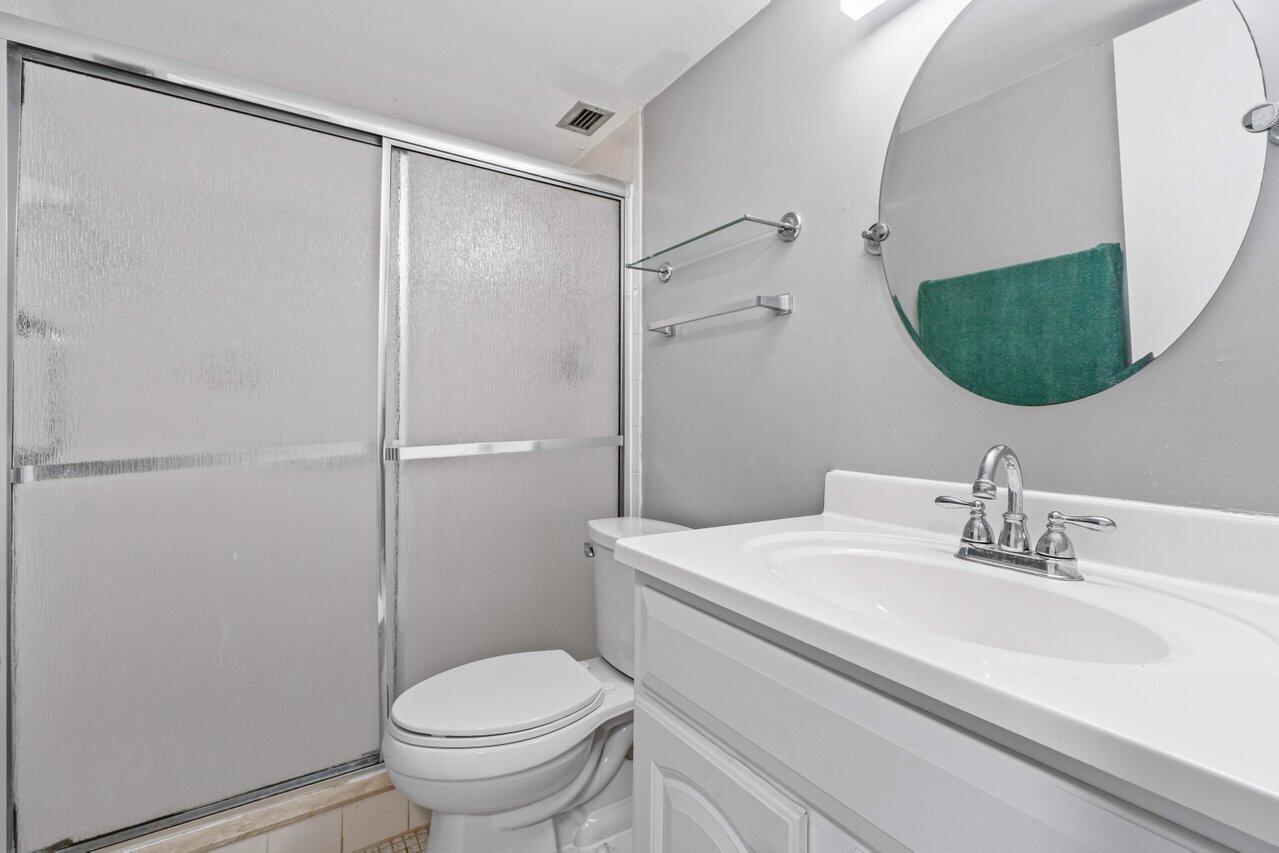 5700 Northwest 2nd Avenue, Unit 401 Boca Raton, FL 33487 - Photo 18 of 30 a bathroom with a sink toilet and shower