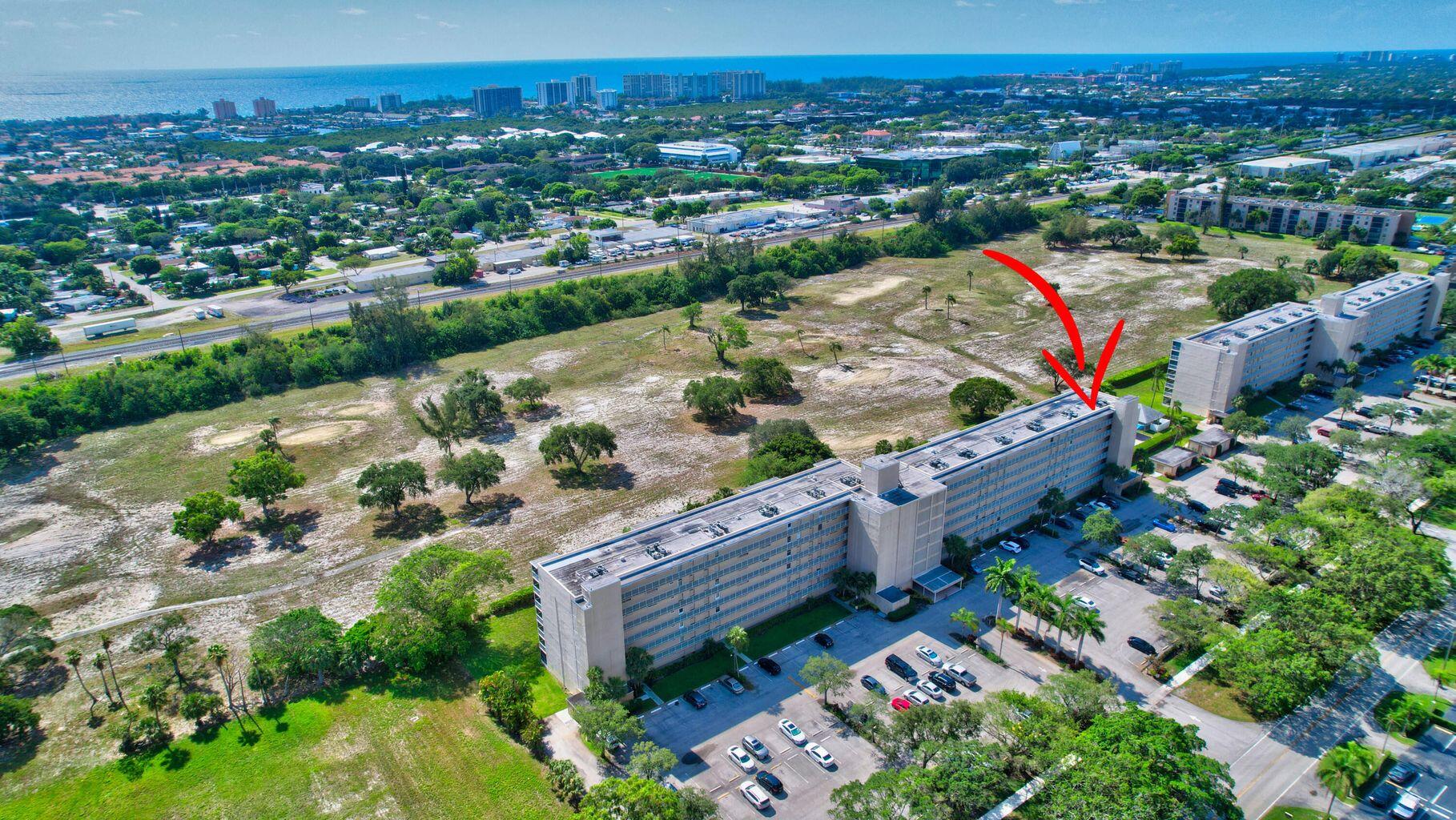 5700 Northwest 2nd Avenue, Unit 401 Boca Raton, FL 33487 - Photo 2 of 30 an aerial view of a house with a garden