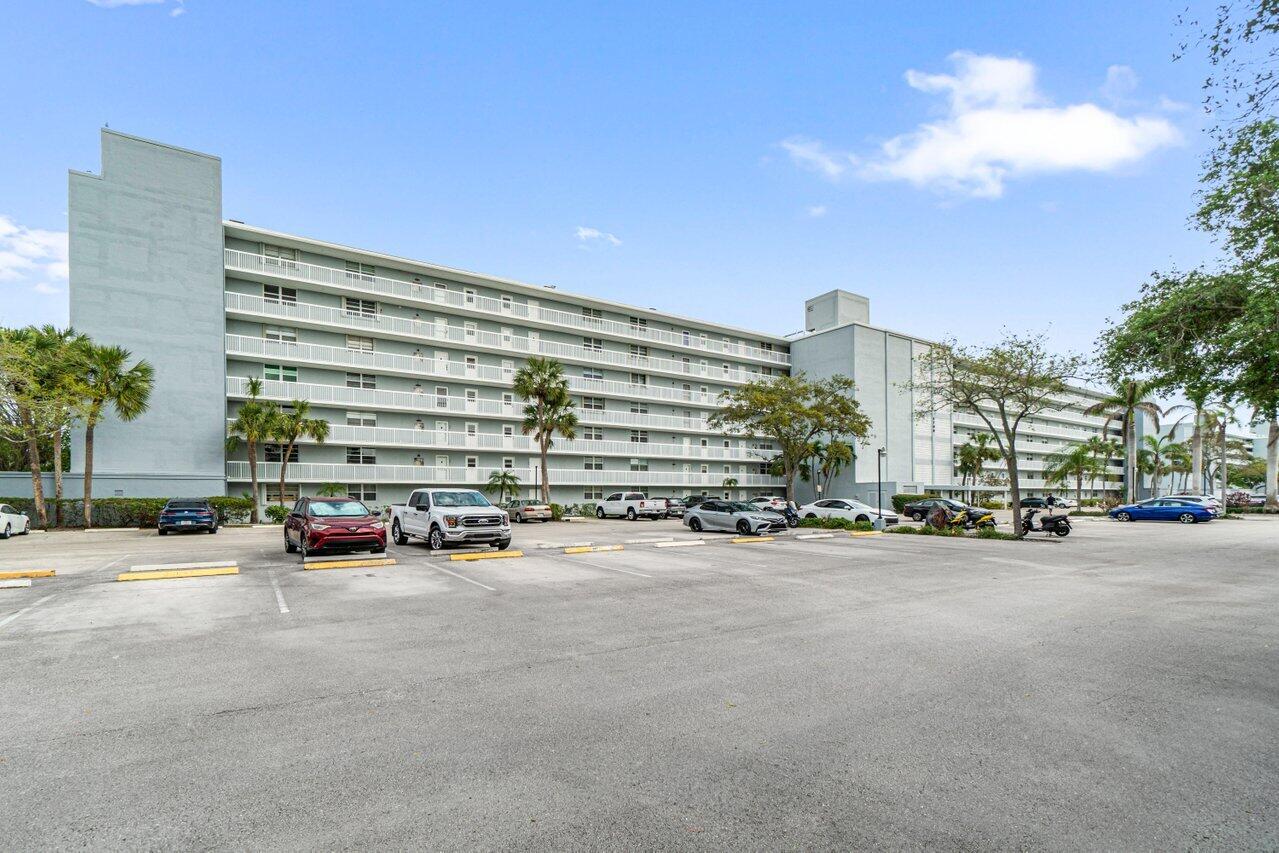 5700 Northwest 2nd Avenue, Unit 401 Boca Raton, FL 33487 - Photo 4 of 30 a view of a city street lined with buildings and trees