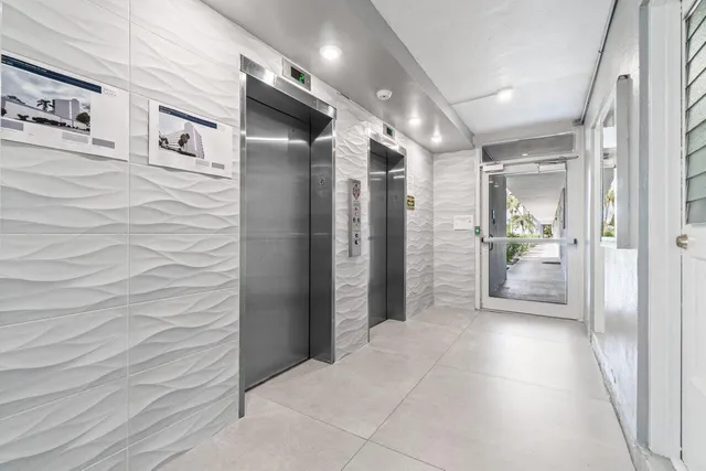 a bathroom with a shower and a sink