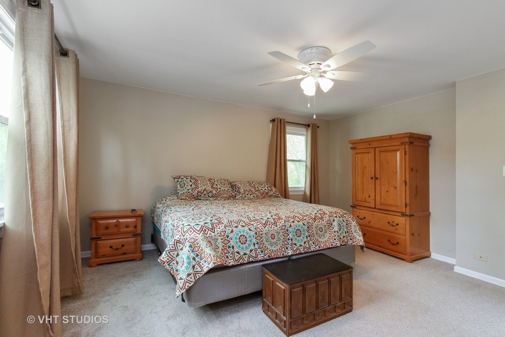 127 Hickory Road Oakwood Hills, IL 60013 - Photo 14 of 28 a bedroom with a bed and a chandelier