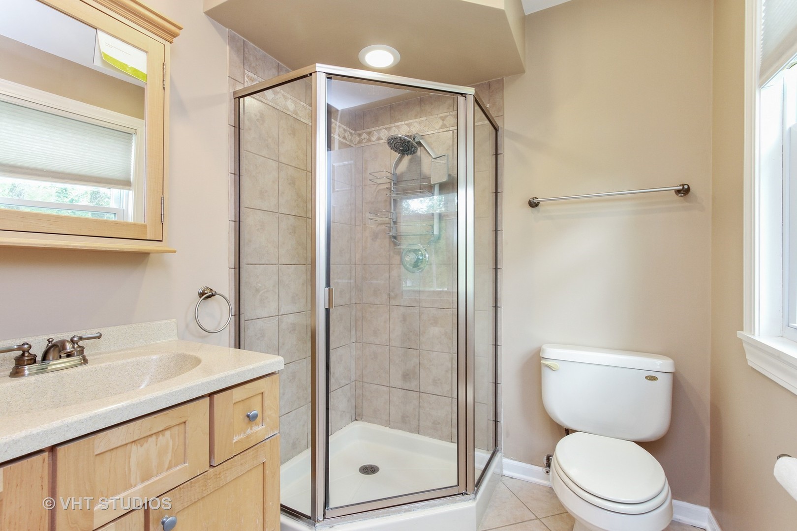 127 Hickory Road Oakwood Hills, IL 60013 - Photo 15 of 28 a bathroom with a shower sink vanity mirror and toilet