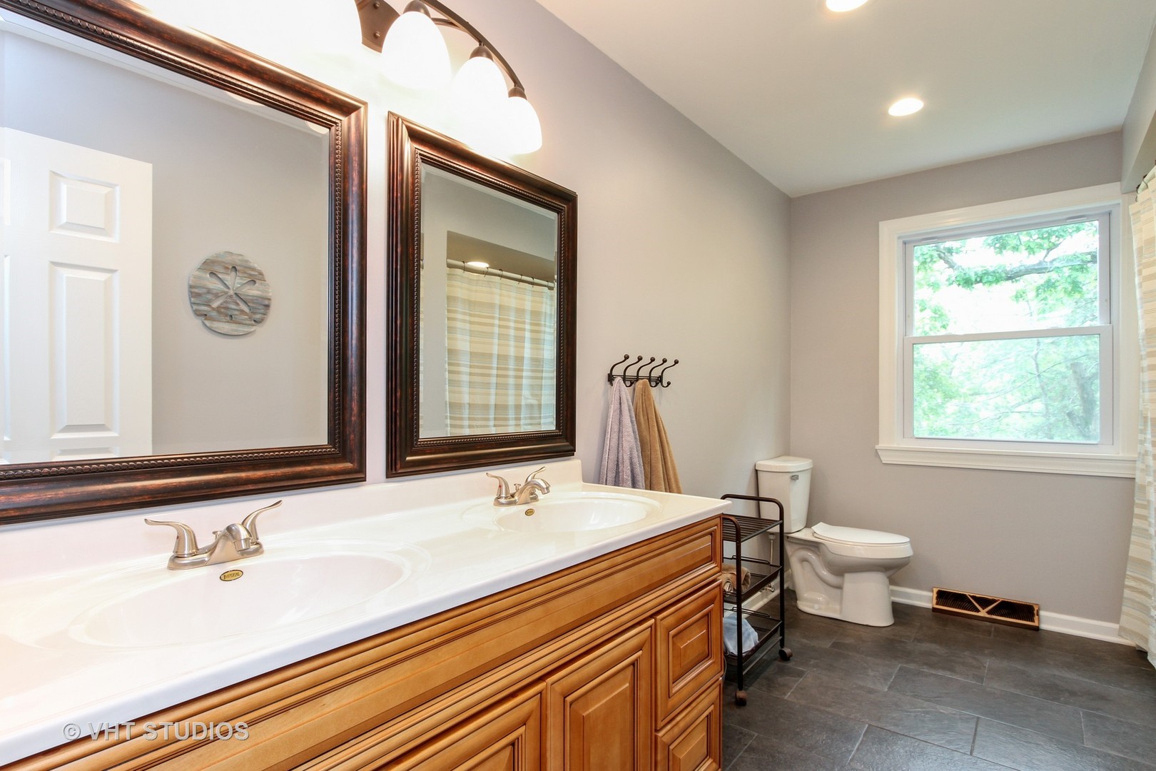 127 Hickory Road Oakwood Hills, IL 60013 - Photo 19 of 28 a bathroom with a sink double vanity and a toilet