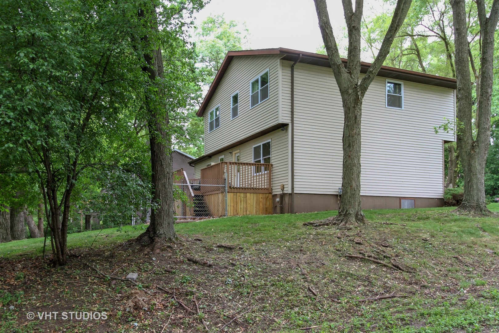 127 Hickory Road Oakwood Hills, IL 60013 - Photo 21 of 28 a house that has a tree in front of the house