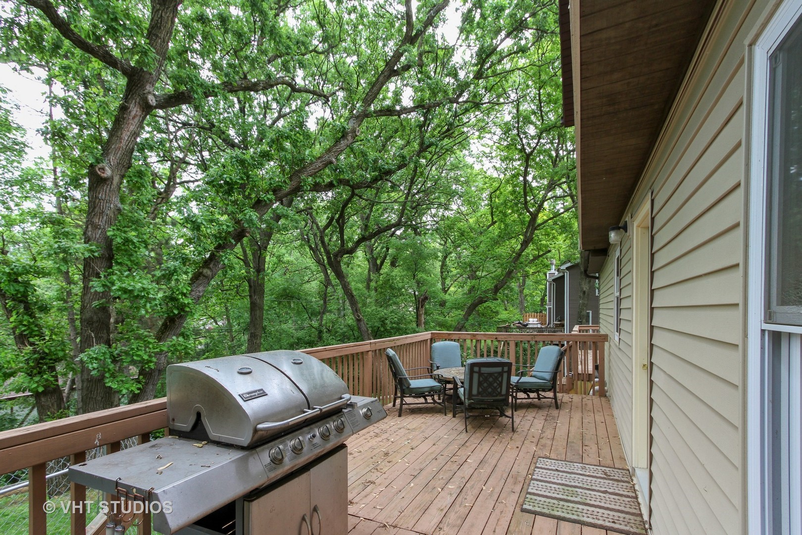 127 Hickory Road Oakwood Hills, IL 60013 - Photo 8 of 28 a wooden bench sitting in backside of a house