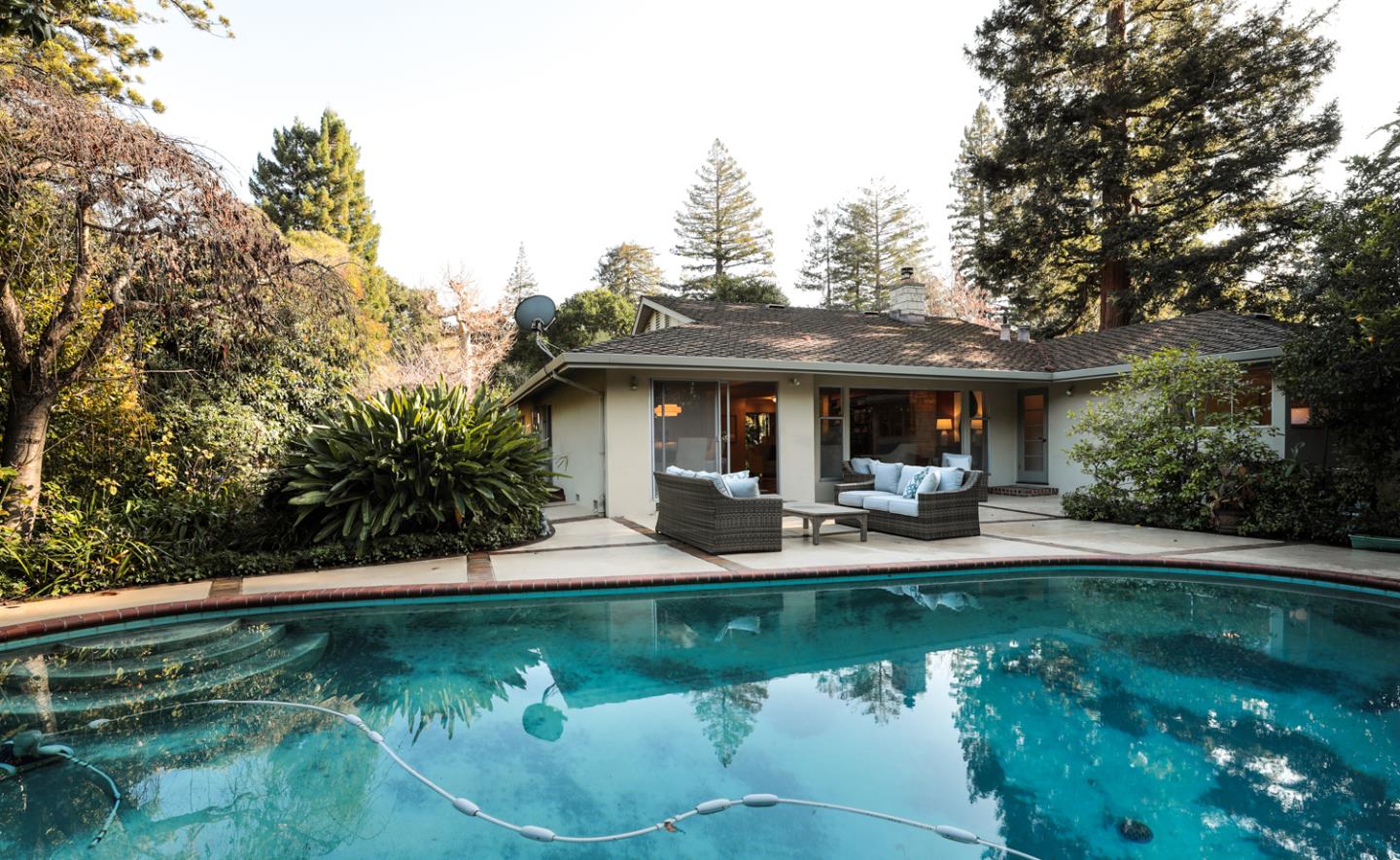 51 Fair Oaks Lane Atherton, CA 94027 - Photo 17 of 22 a view of a house with swimming pool and sitting area