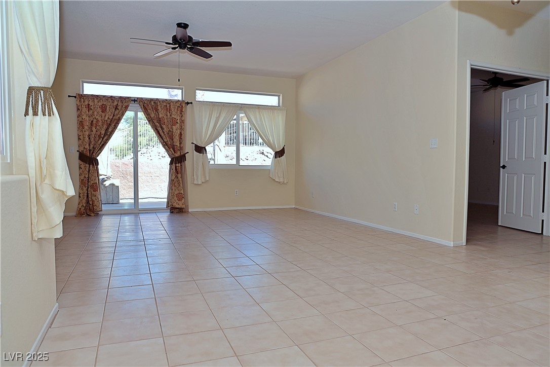 3349 Partridge Run Street Laughlin, NV 89029 - Photo 13 of 58 Spare room with a ceiling fan and light tile patterned floors