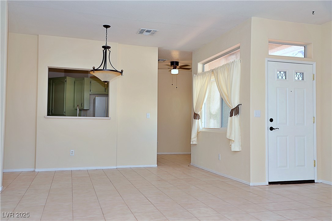 3349 Partridge Run Street Laughlin, NV 89029 - Photo 16 of 58 Entrance foyer with ceiling fan and light tile patterned floors