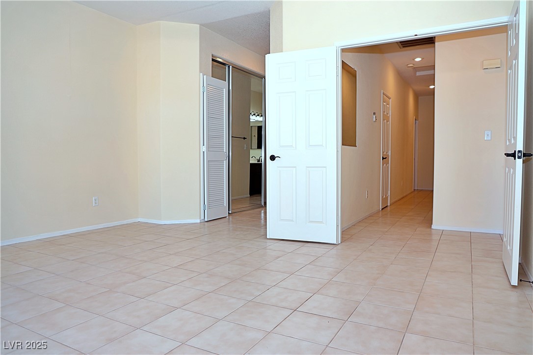 3349 Partridge Run Street Laughlin, NV 89029 - Photo 26 of 58 Unfurnished room with light tile patterned flooring and recessed lighting