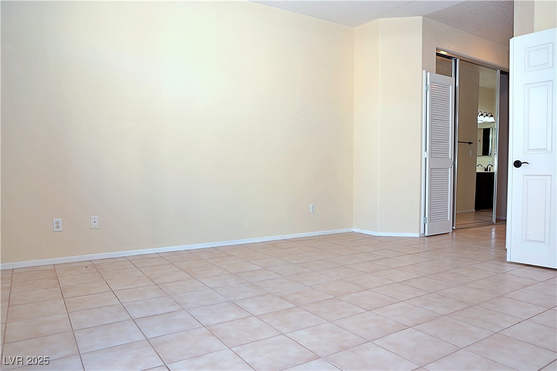 3349 Partridge Run Street Laughlin, NV 89029 - Photo 27 of 58 Unfurnished room with light tile patterned flooring and baseboards