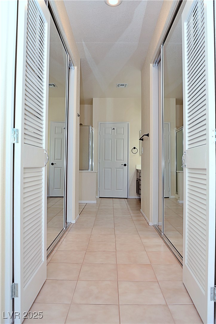 3349 Partridge Run Street Laughlin, NV 89029 - Photo 29 of 58 Hall with light tile patterned floors