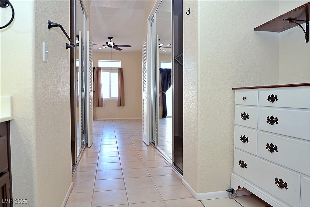 3349 Partridge Run Street Laughlin, NV 89029 - Photo 33 of 58 Hall with a textured wall and light tile patterned floors