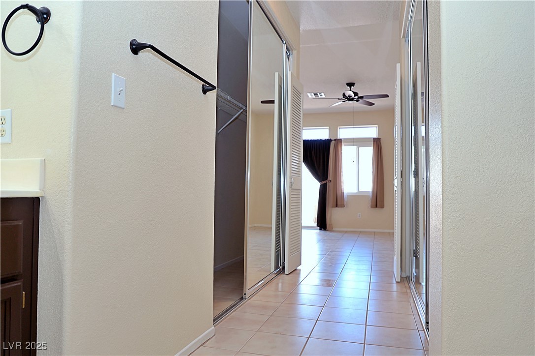 3349 Partridge Run Street Laughlin, NV 89029 - Photo 34 of 58 Corridor with a textured wall and light tile patterned floors