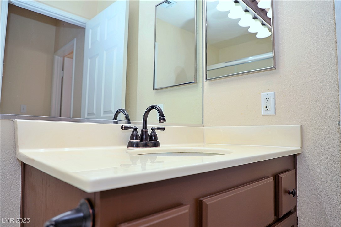 3349 Partridge Run Street Laughlin, NV 89029 - Photo 42 of 58 Bathroom with a textured wall and vanity