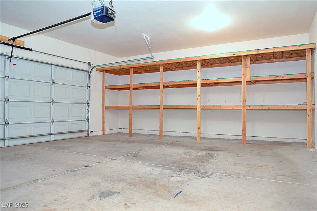 3349 Partridge Run Street Laughlin, NV 89029 - Photo 47 of 58 Garage featuring a garage door opener