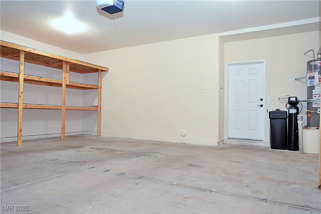 3349 Partridge Run Street Laughlin, NV 89029 - Photo 50 of 58 Garage featuring a garage door opener and secured water heater