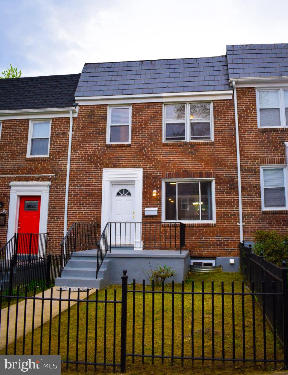 4227 Flowerton Road Baltimore, MD 21229 - Photo 1 of 45 a front view of a house with a yard