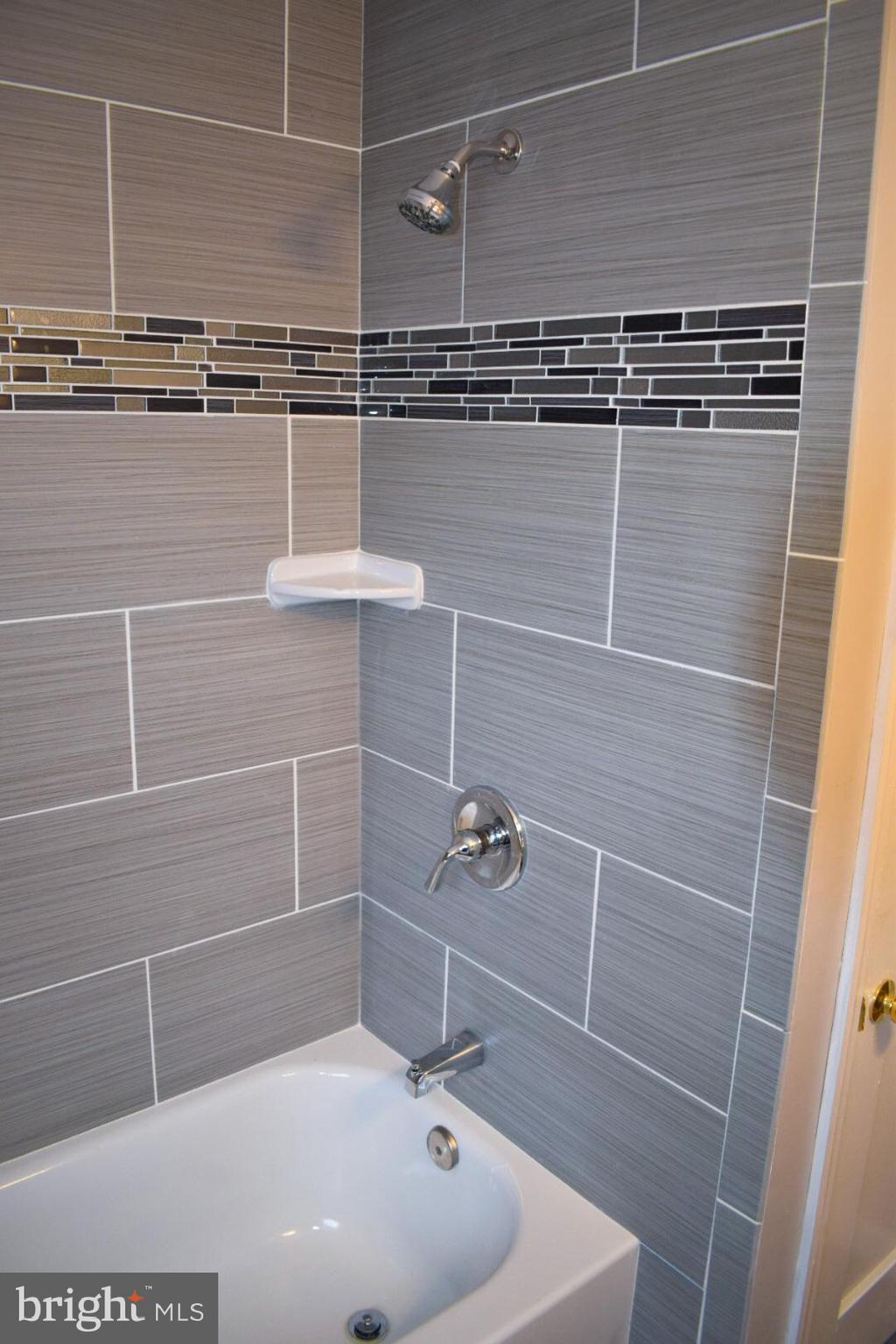 4227 Flowerton Road Baltimore, MD 21229 - Photo 21 of 45 a bathroom with a shower