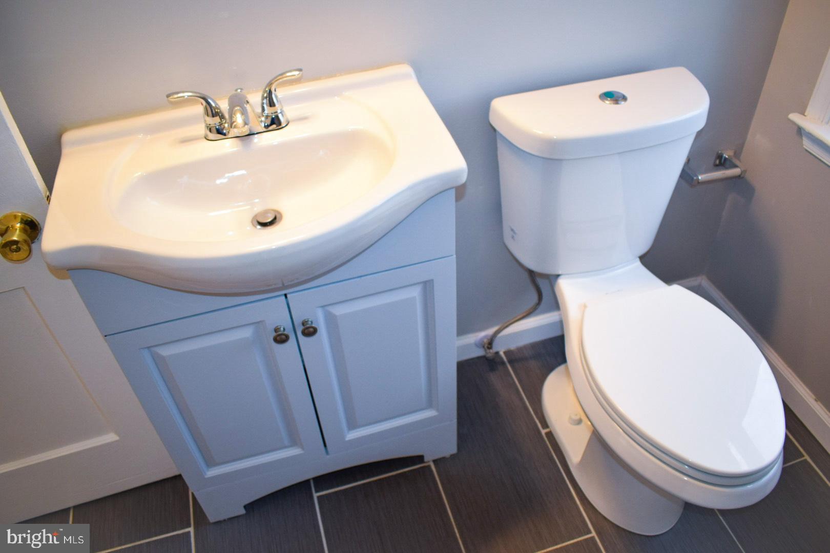 4227 Flowerton Road Baltimore, MD 21229 - Photo 23 of 45 a bathroom with a toilet and a sink