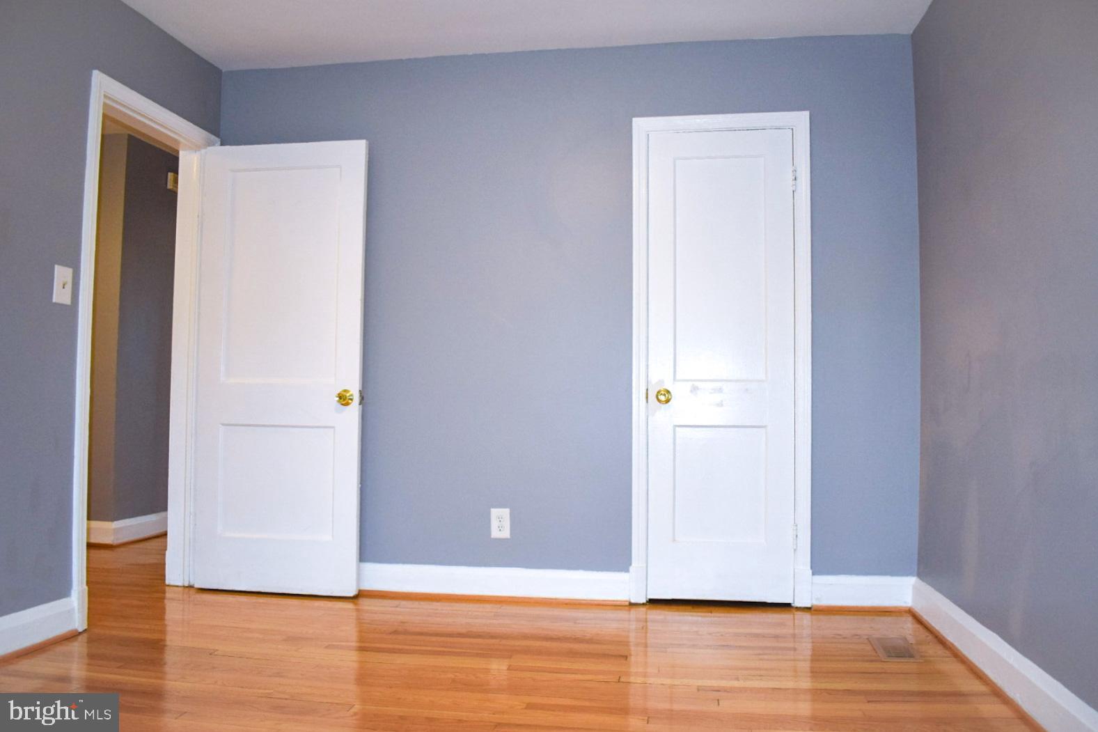 4227 Flowerton Road Baltimore, MD 21229 - Photo 24 of 45 a view of an empty room with wooden floor