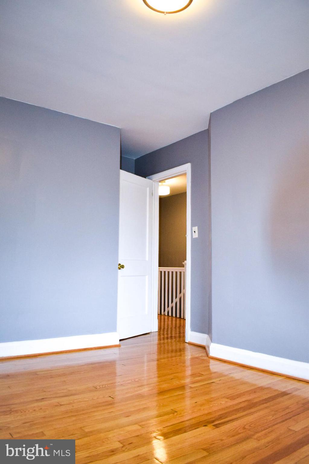 4227 Flowerton Road Baltimore, MD 21229 - Photo 28 of 45 a view of empty room with wooden floor