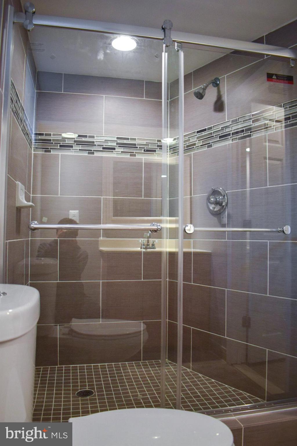 4227 Flowerton Road Baltimore, MD 21229 - Photo 34 of 45 a bathroom with a shower