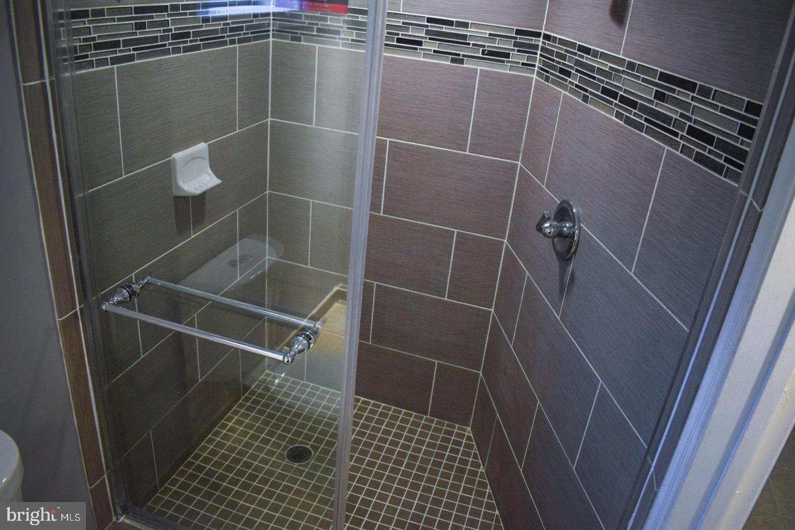 4227 Flowerton Road Baltimore, MD 21229 - Photo 35 of 45 a bathroom with a shower