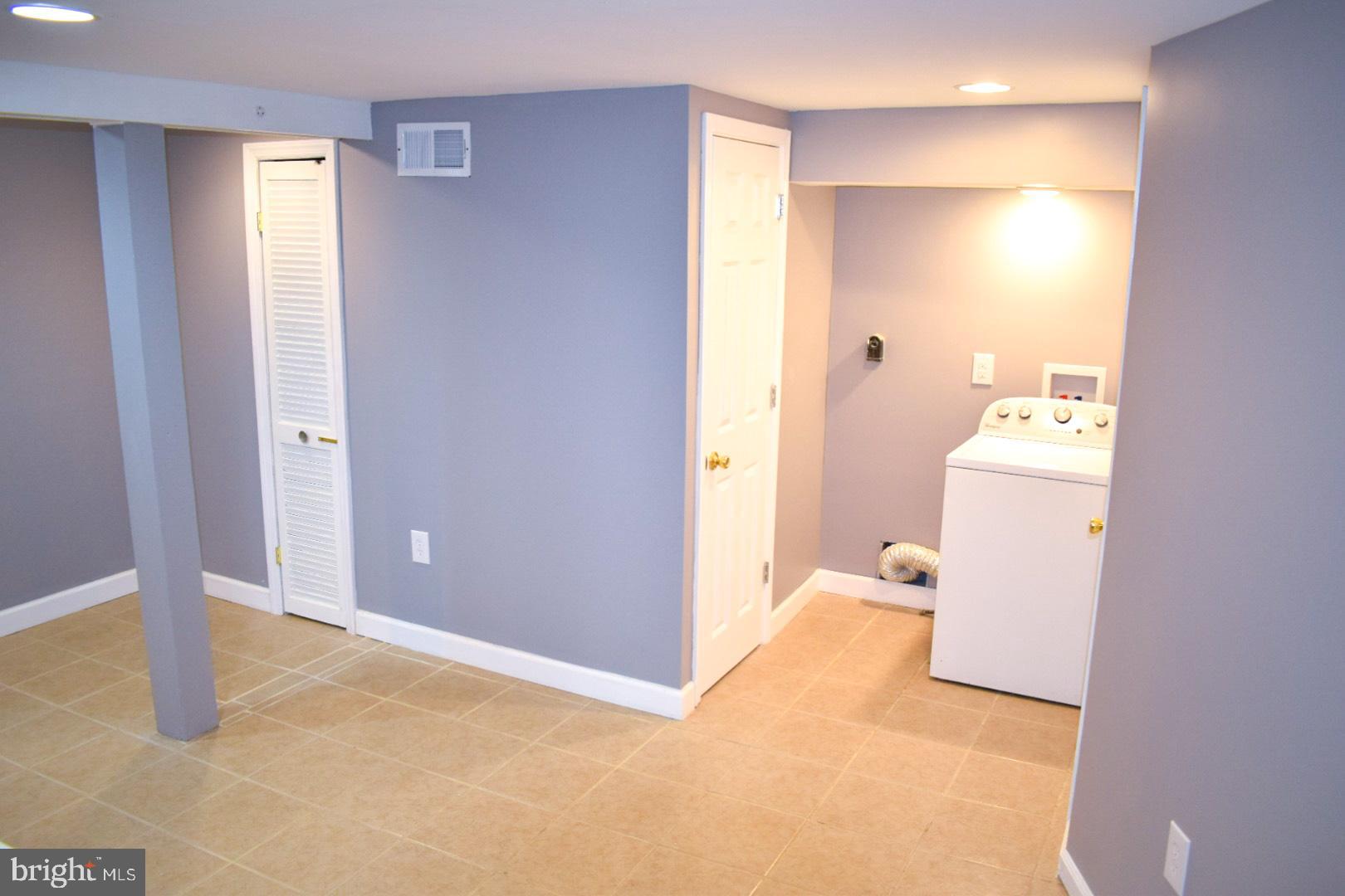 4227 Flowerton Road Baltimore, MD 21229 - Photo 37 of 45 a view of a room with refrigerator and mirror
