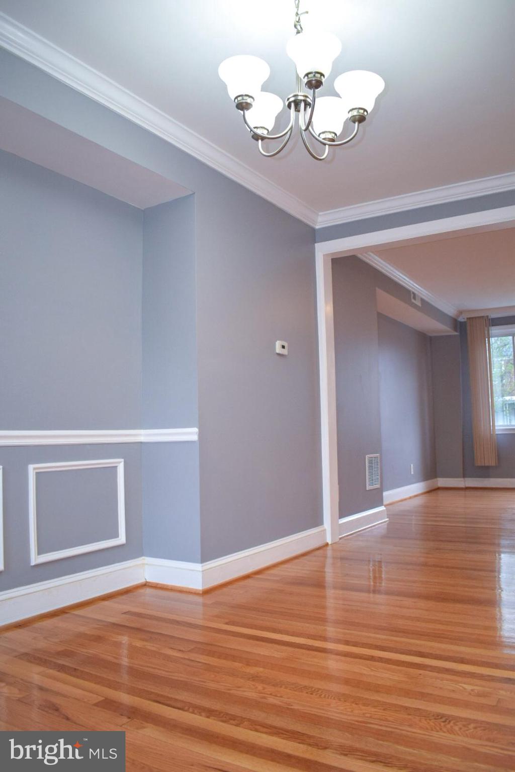 4227 Flowerton Road Baltimore, MD 21229 - Photo 6 of 45 a view of an empty room with wooden floor