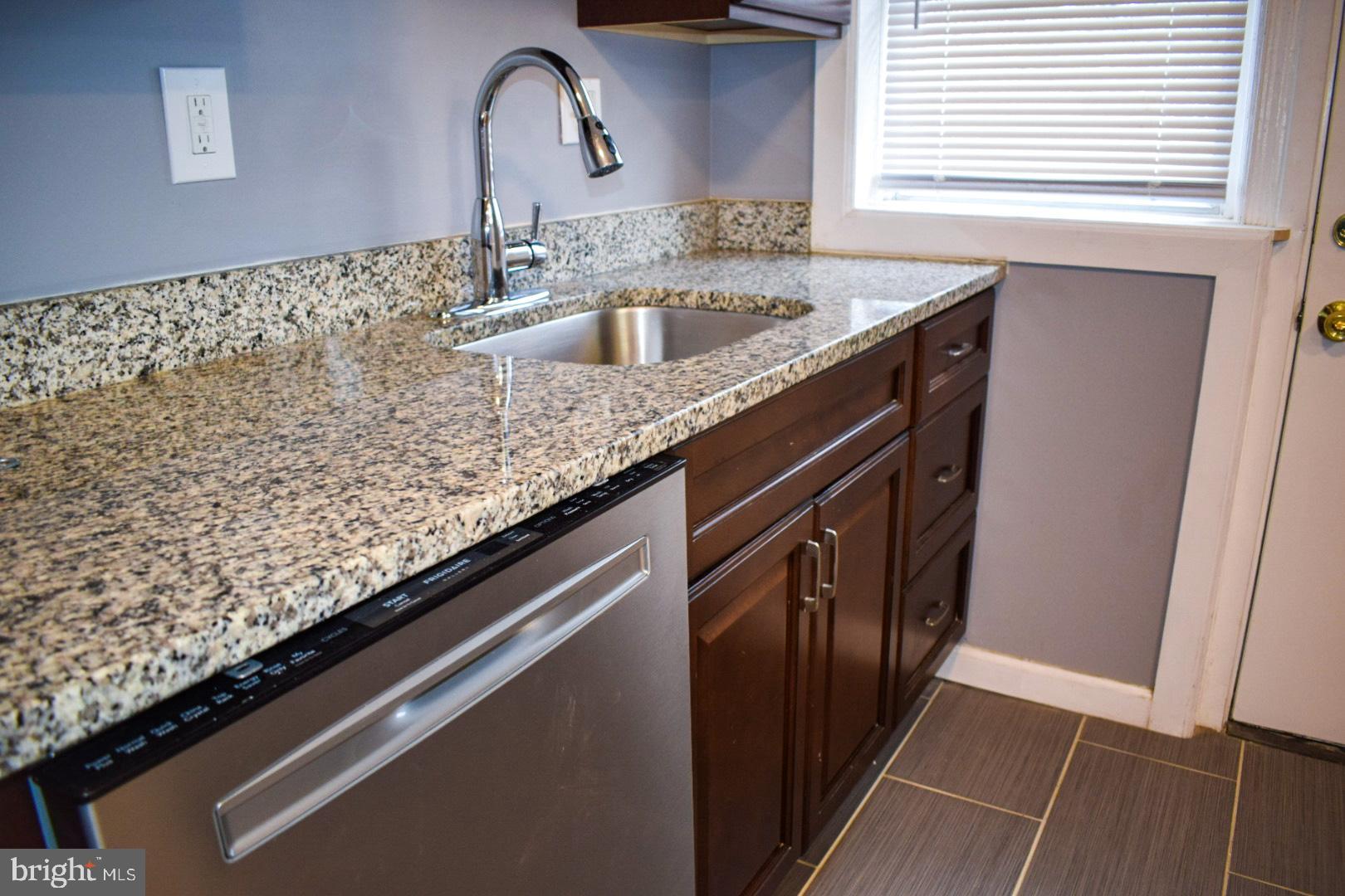 4227 Flowerton Road Baltimore, MD 21229 - Photo 9 of 45 a kitchen with a sink and cabinets