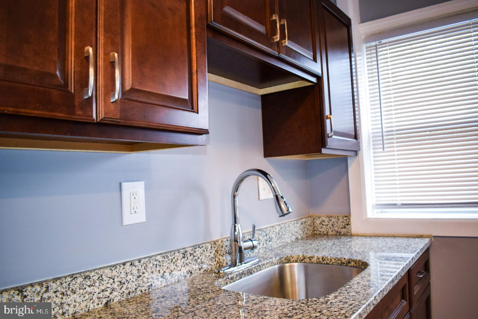 4227 Flowerton Road Baltimore, MD 21229 - Photo 10 of 45 a kitchen with a sink and a window